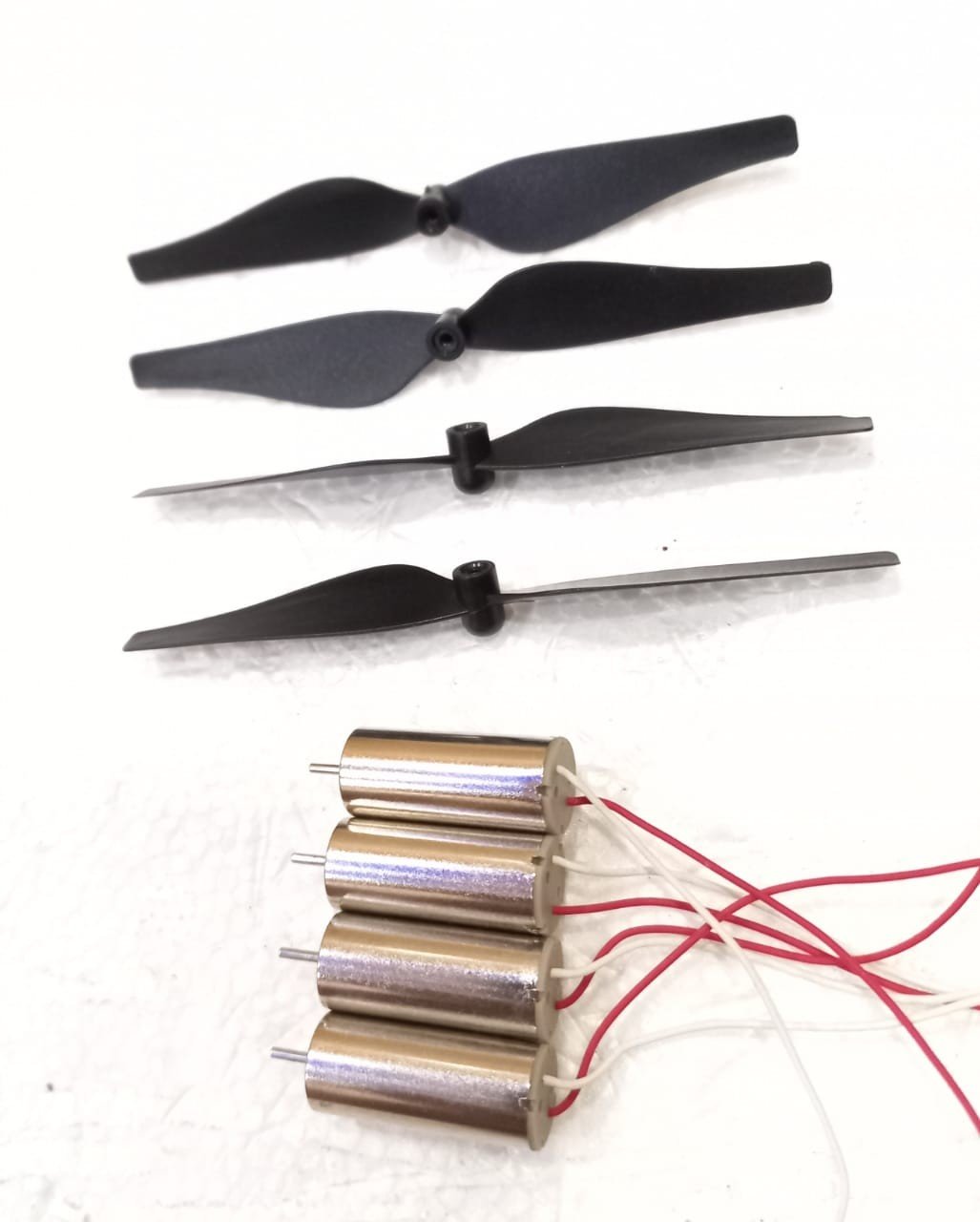 Mini drone motors with propellers.